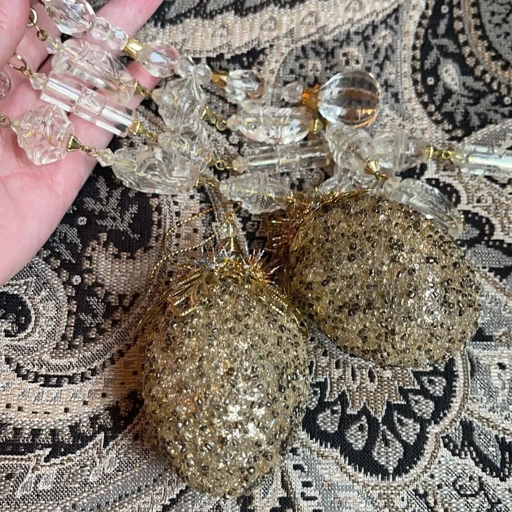 TWO LIGHT gold & bronze studded ornaments & fringe